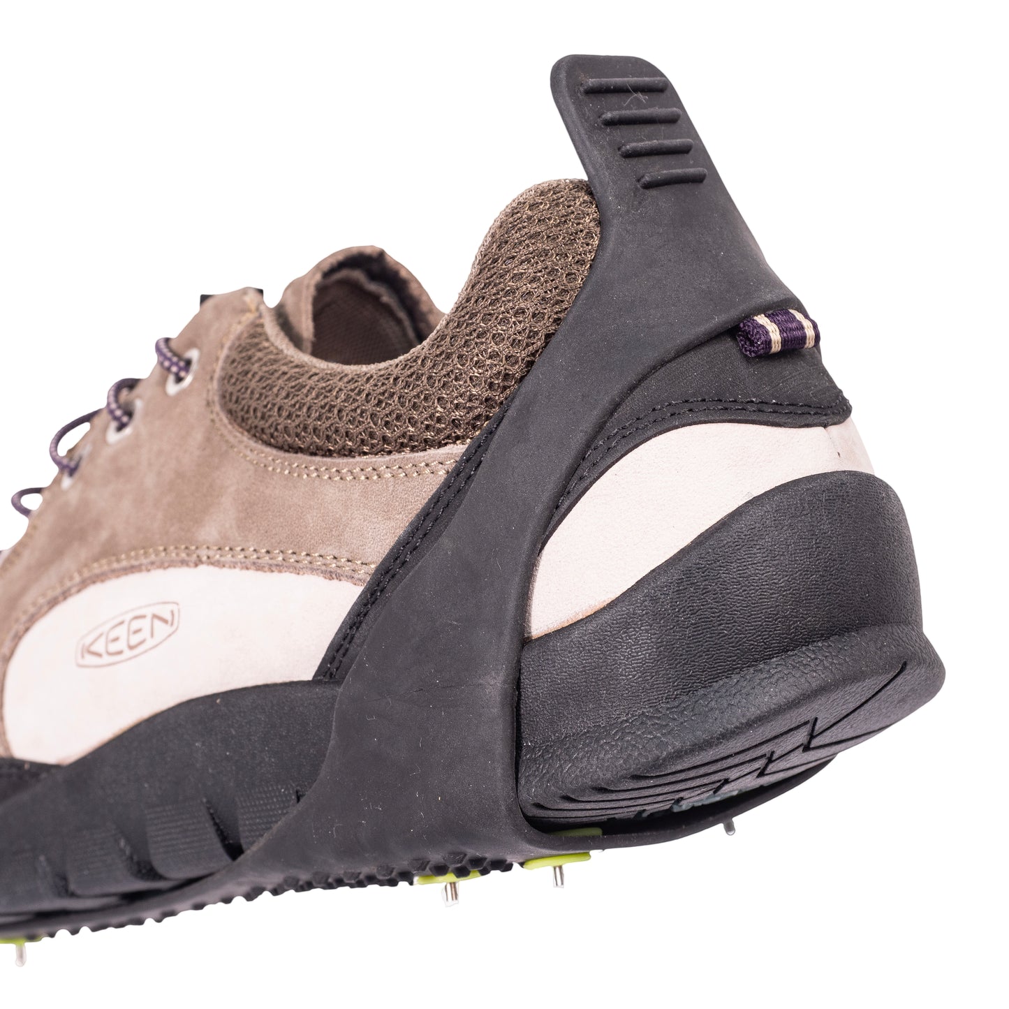 Picture shows the rear attachment of some 8 stud crampons onto a walking shoe.