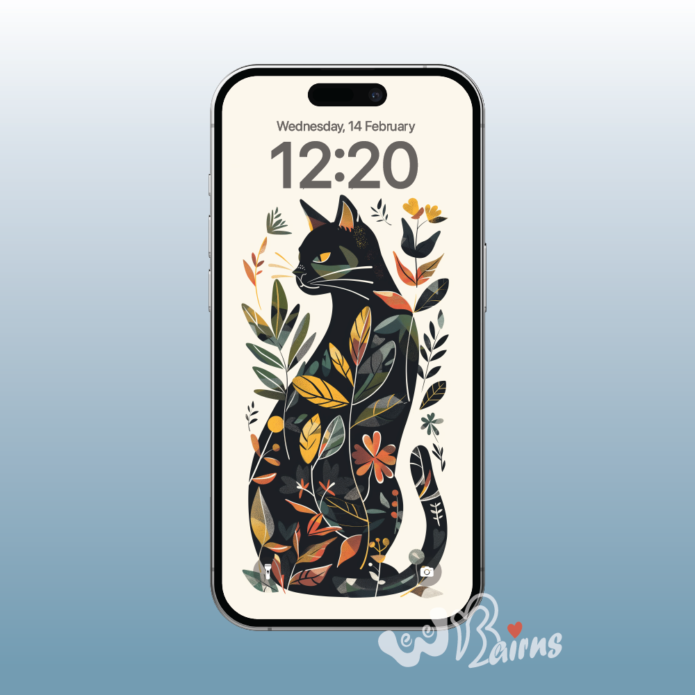 Picture shows a black cat looking left surrounded by colourful leaves.