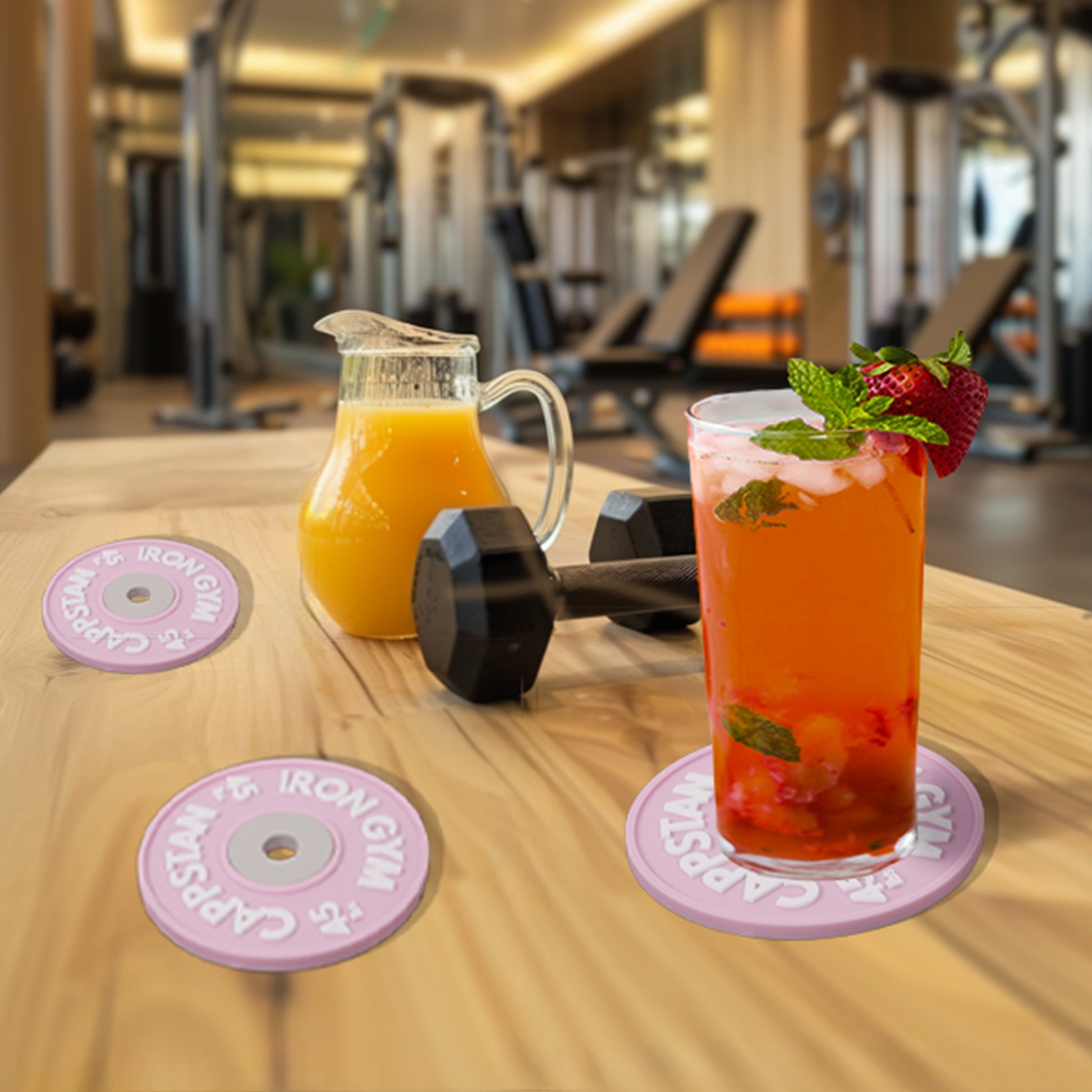 The subjects in this image are the pink coasters and the gym background was generated in Midjourney.